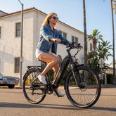 Marathon Long-Range City E-Bike - woman riding on city street